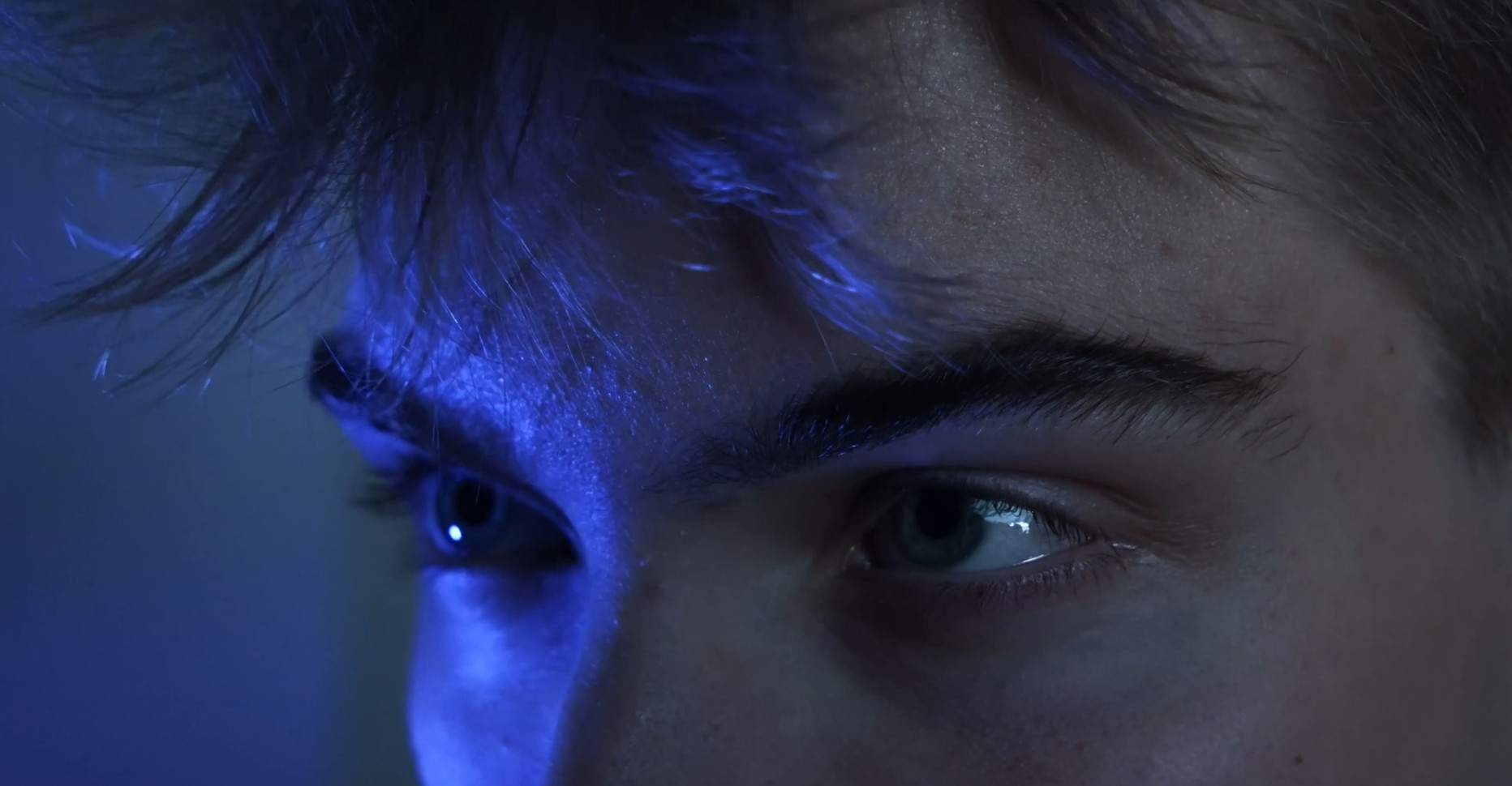 Blue-lit close-up from Eight Miles High